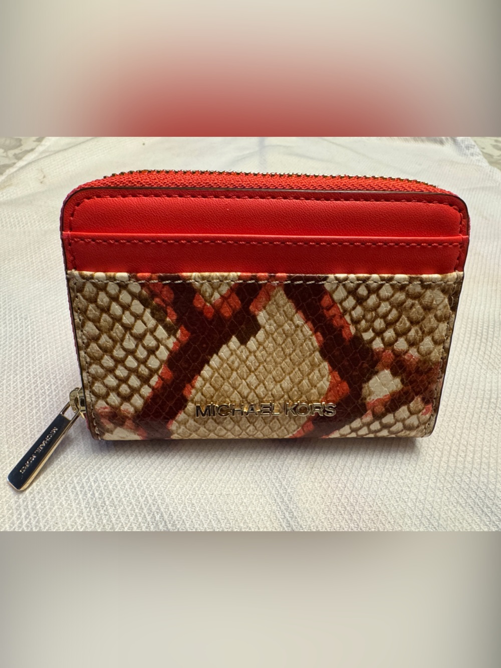 Michael Kors Red and Beige Snake-Print Zip Card Case. Condition: Like New.